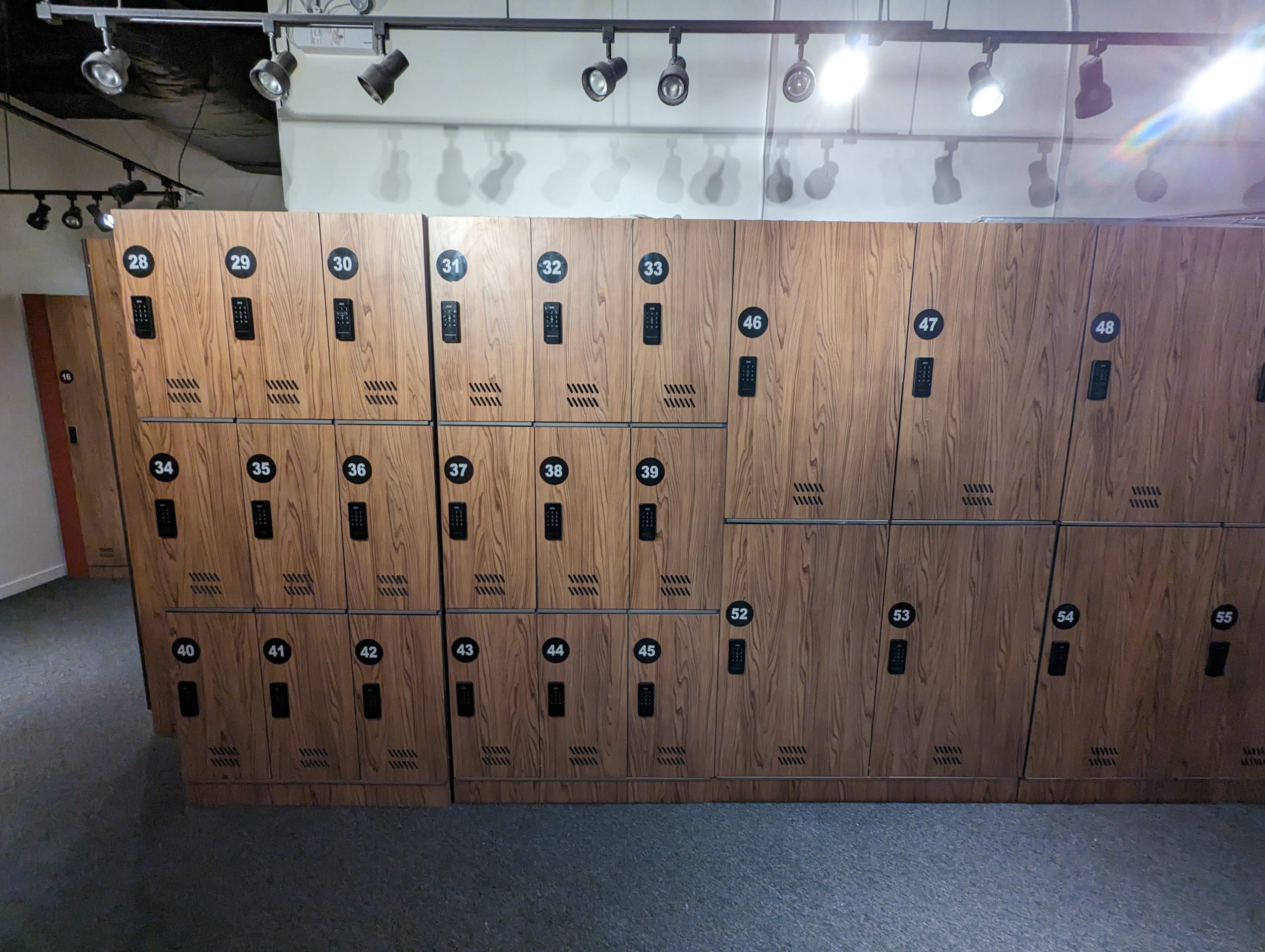 A row of ski lockers in a room.